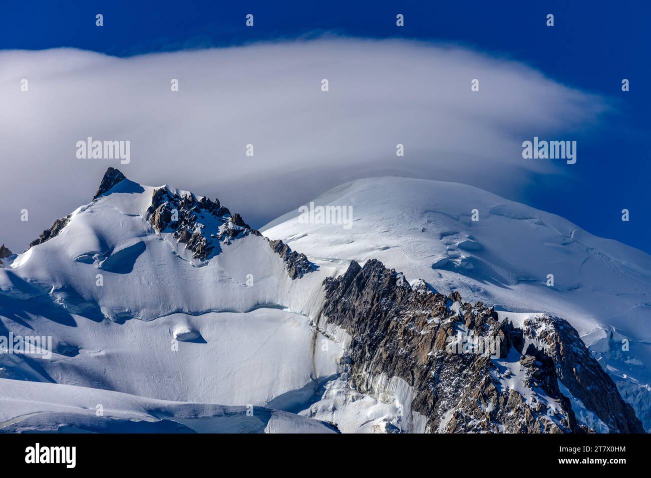 Alps snowcapped mountains in Chamonix, view from Aiguille du Midi peak summit. Alpine snow and glacier landscape in french Alps, range of Montblanc Stock Photo