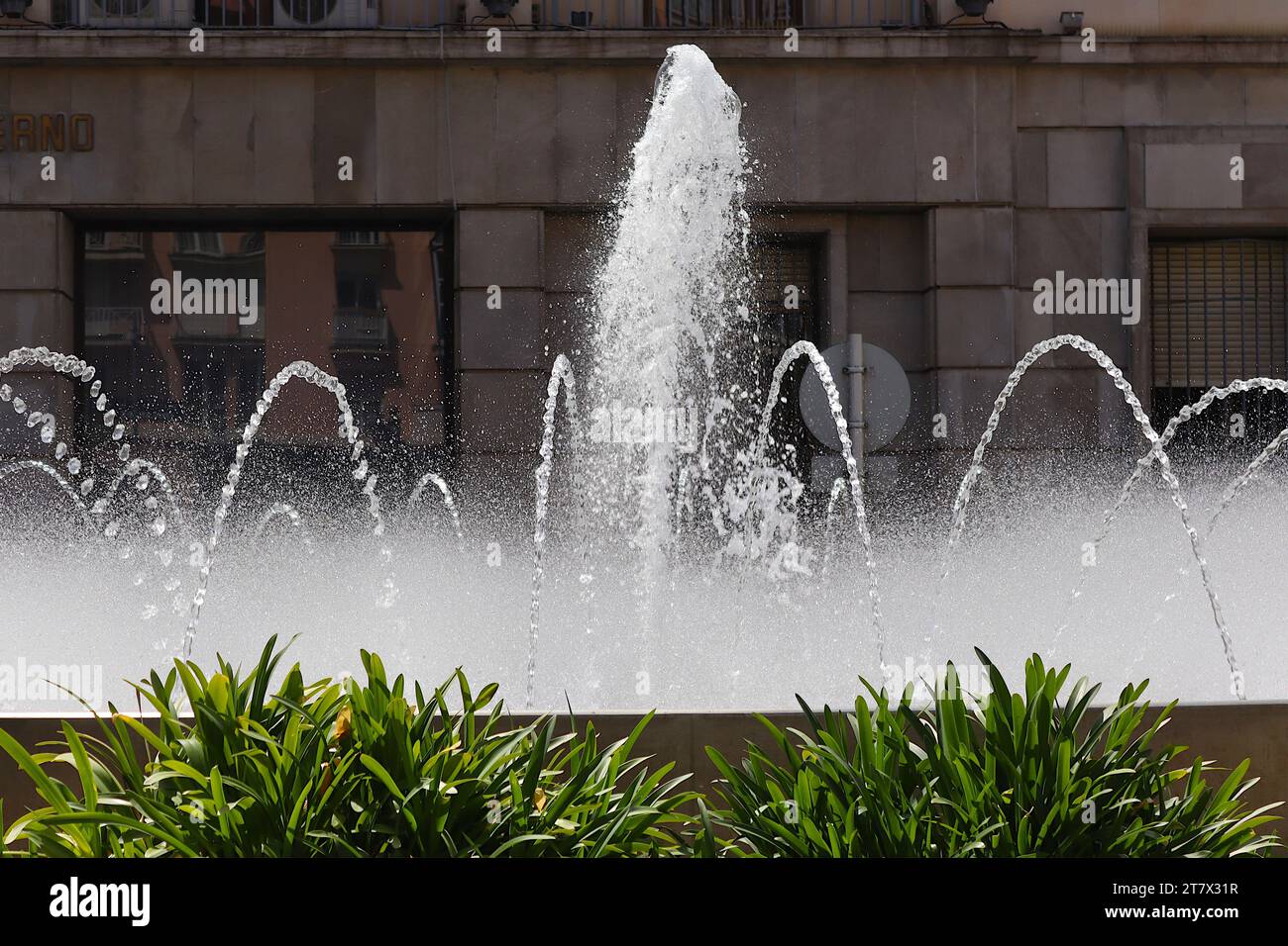 Jets of water frozen by the camera creating the illusion of pearls of crystal glass at a Fountain display in the Plaza De Los Reyes, Ceuta, Spain. Stock Photo