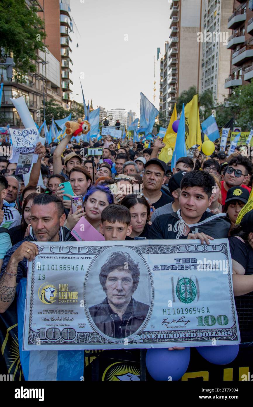 Cordoba, Argentina. 16th Nov, 2023. People hold up a US dollar bill with a portrait of the right-wing conservative presidential candidate Milei during his final campaign rally. Milei promises to abolish the Argentinian central bank and introduce the US dollar as the currency. Credit: Sebastian Salguero/dpa/Alamy Live News Stock Photo