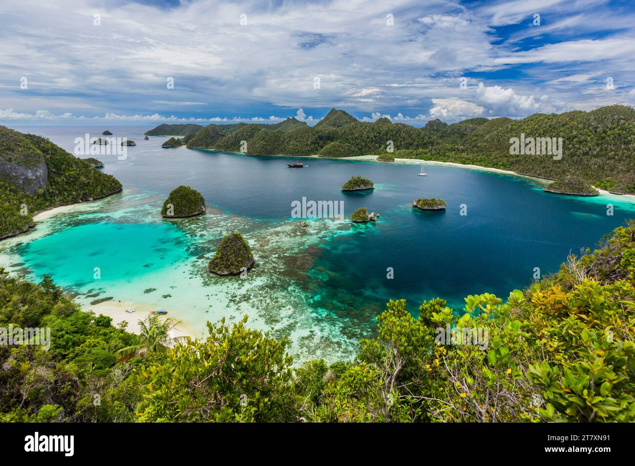 A view from on top of the small islets of the natural protected harbor in Wayag Bay, Raja Ampat, Indonesia, Southeast Asia, Asia Stock Photo