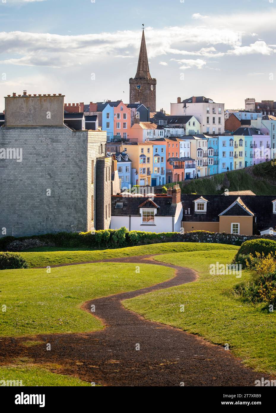 Colorful rooftops and church spire in the seaside village of Tenby on the Pembrokeshire Coast, Wales, United Kingdom, Europe Stock Photo