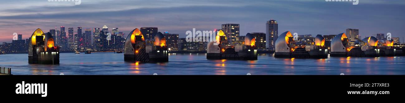 Thames Barrier dusk panorama with Canary Wharf beyond, London, England ...