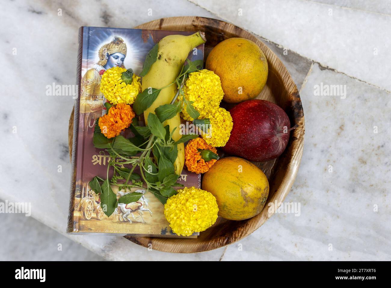 Offerings at ISKCON temple, flowers, fruit and Bhagavad Gita in Juhu, Mumbai, India, Asia Stock Photo