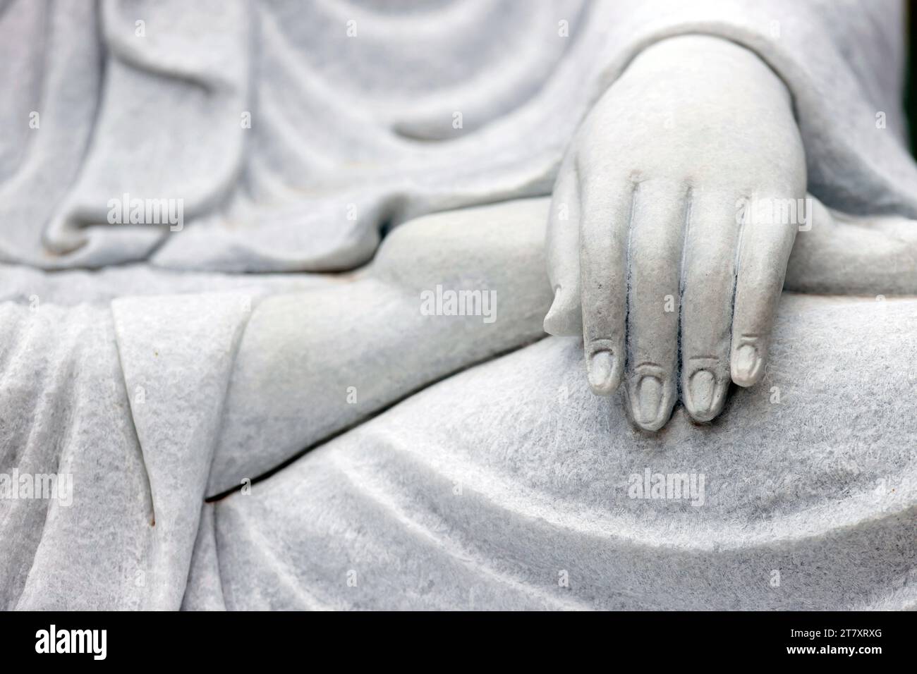 Hand of marble statue of the Goddess of Mercy and Compassion, Bodgisattva Avalokitshevara (Guanyin) (Quan Am), Tinh That Quan Am Pagoda Stock Photo