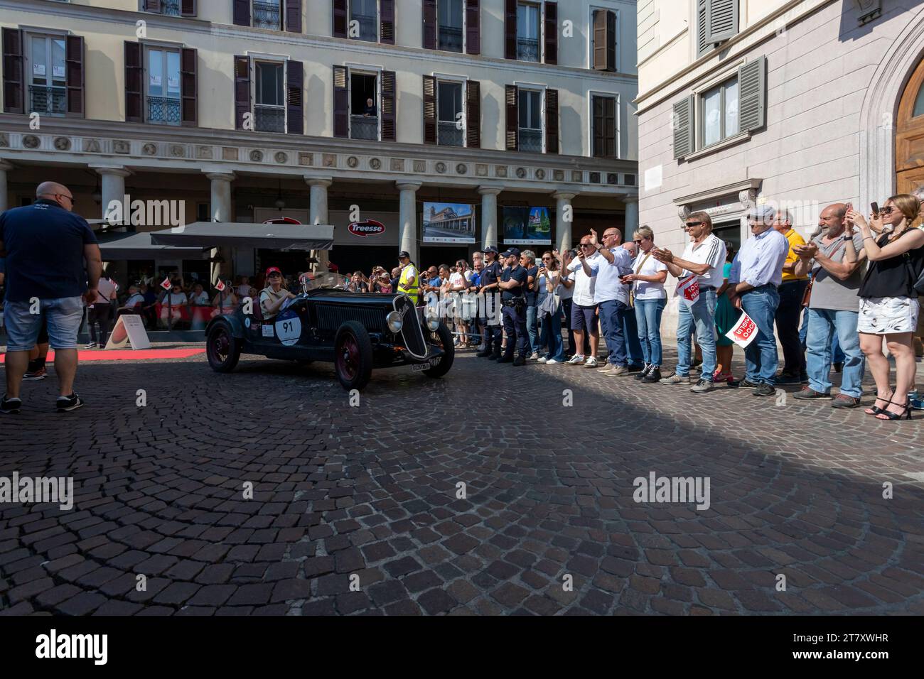 1000 Miglia, parade of historic cars between two wings of the crowd, Novara, Piedmont, Italy, Europe Stock Photo