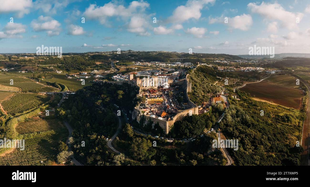 Aerial panoramic view of the famous July Medieval Fair festival in Obidos, a UNESCO World Heritage Site as a Creative City of Literature Stock Photo