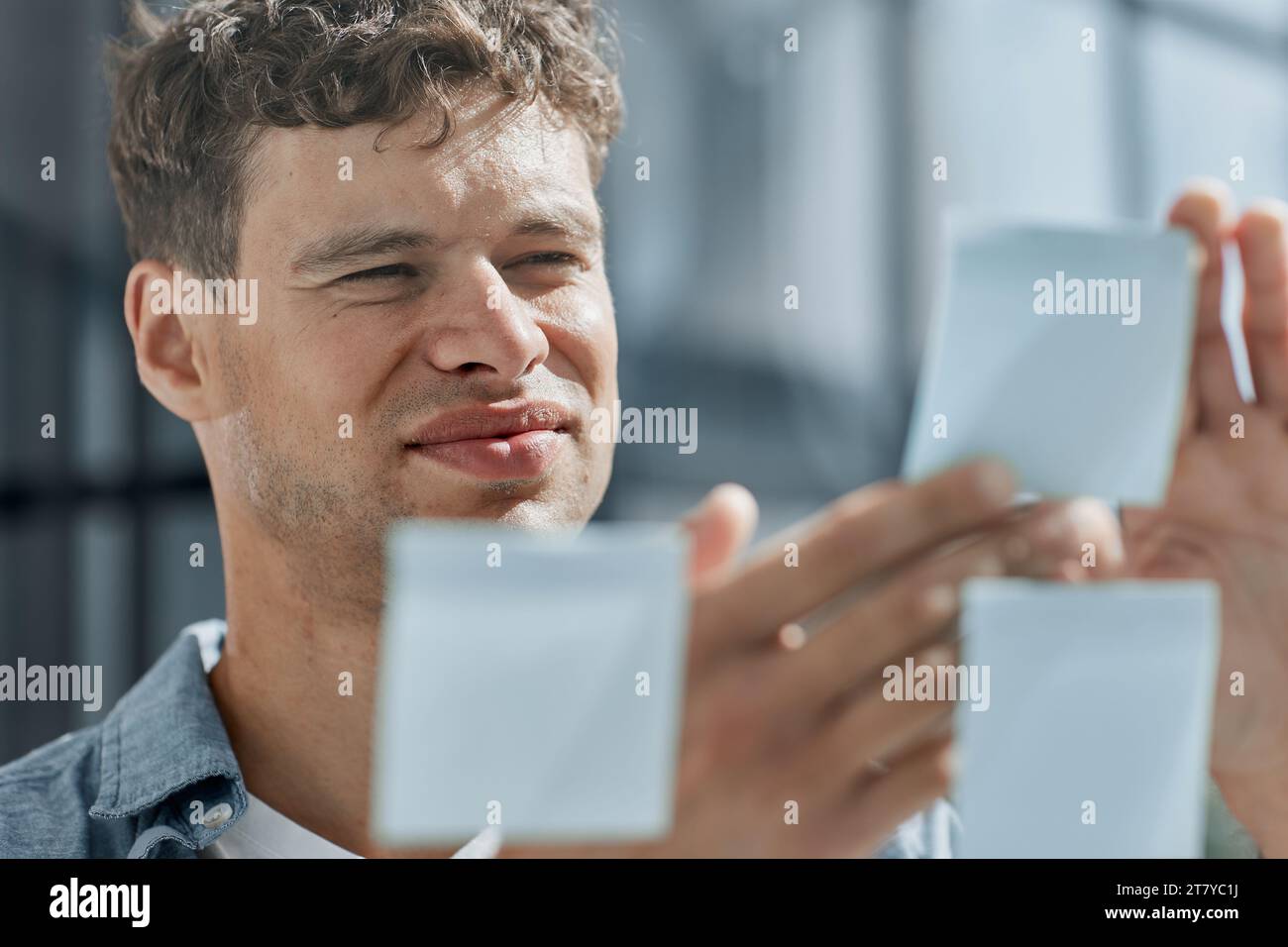 young office man at workplace making notes Stock Photo