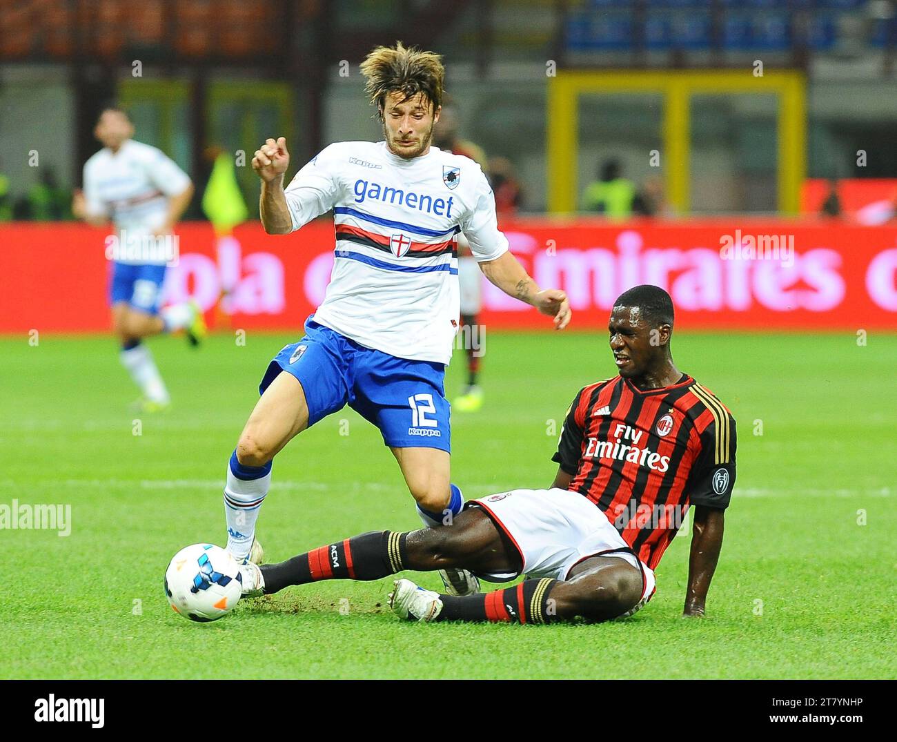 Gianluca Sansone of UC Sampdoria fights for the ball with Cristian Zapata of AC Milan during the italian championship 2013/2014 football match between AC Milan and UC Sampdoria in Milan, Italy on September 28, 2013. Photo Massimo Cebrelli / DPPI Stock Photo