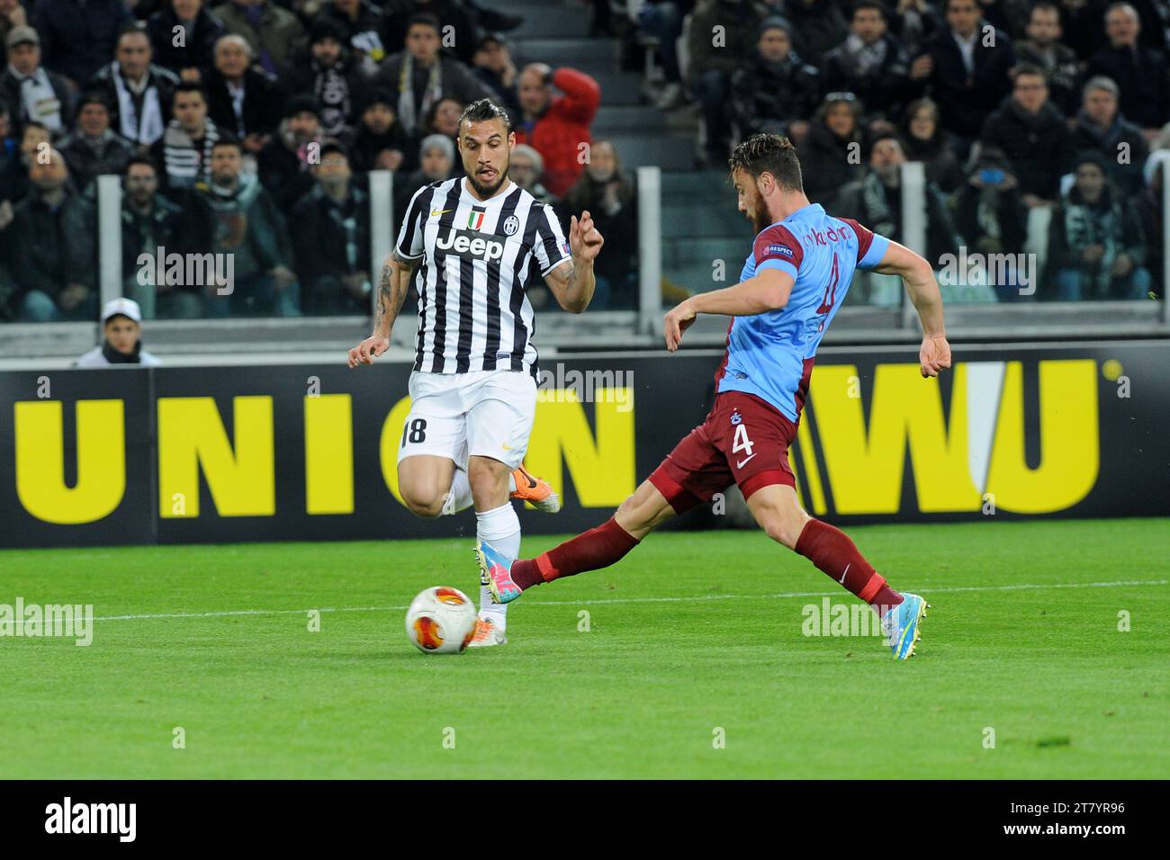 Pablo Osvaldo of FC Juventus and Aykut Demir of Trabzonspor AS fight for the ball during the UEFA Europa League football match round of 32 first leg between FC Juventus and Trabzonspor AS on February 20, 2014 in Turin, Italy. Photo Massimo Cebrelli / DPPI Stock Photo
