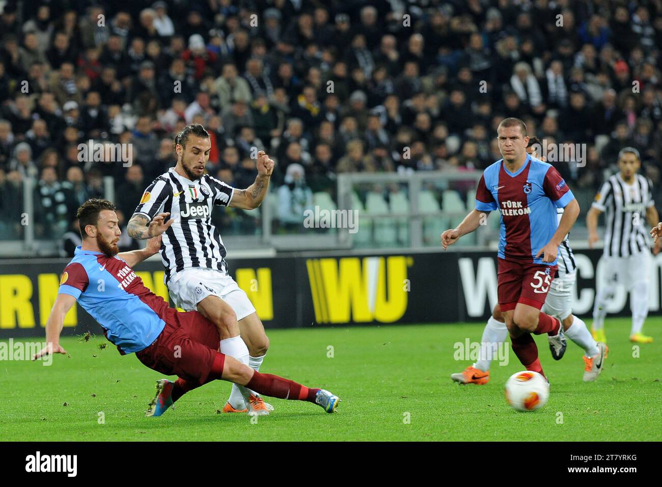 Pablo Osvaldo of FC Juventus is Tackled by Aykut Demir of Trabzonspor AS during the UEFA Europa League football match round of 32 first leg between FC Juventus and Trabzonspor AS on February 20, 2014 in Turin, Italy. Photo Massimo Cebrelli / DPPI Stock Photo
