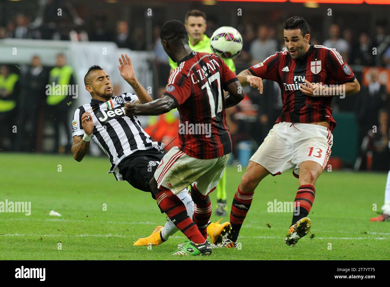 Arturo Vidal of Juventus FC vies for theball with Cristian Zapata and Adil Rami of AC Milan during the italian championship Serie A football match between AC Milan and Juventus FC on September 20, 2014 at Giuseppe Meazza Stadium in Milan, Italy. Photo Massimo Cebrelli / DPPI Stock Photo