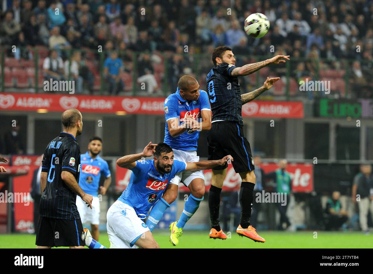 Mauro Icardi of FC Inter Milan jumps for the ball with Gokhan Inler of SSC Napoli during the italian championship 2014/2015 Serie A football match between FC Internazional and SSC Napoli at Giuseppe Meazza Stadium on October 19, 2014 in Milan, Italy. Photo Massimo Cebrelli / DPPI Stock Photo