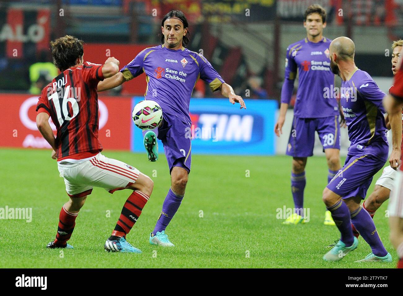 Andrea Poli of AC Milan and Alberto Aquilani of ACF Fiorentina vie for the ball during the Italian Championship Serie A football match between AC Milan and ACF Fiorentina at Giuseppe Meazza Stadium on October 26, 2014 in Milan, Italy. Photo Massimo Cebrelli / DPPI Stock Photo