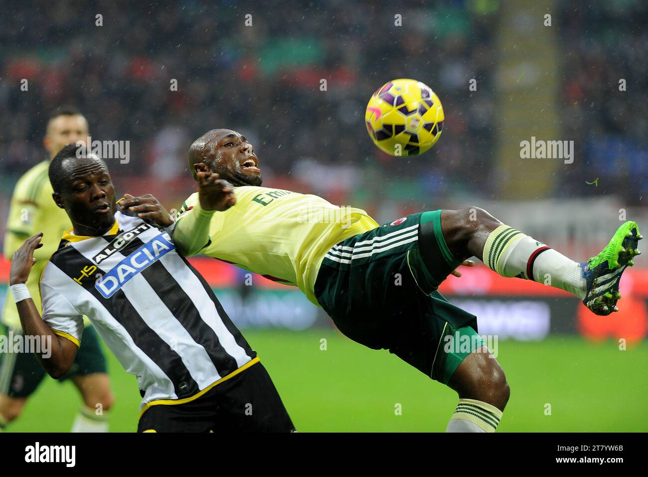 Emmanuel Agyemang Badu of Udinese Calcio and Pablo Estifel Armero of AC Milan fight for the ball during the Italian championship Serie A football match between AC Milan and Udinese on November 30, 2014 at San Siro Stadium in Milan, Italy. Photo Massimo Cebrelli / DPPI Stock Photo