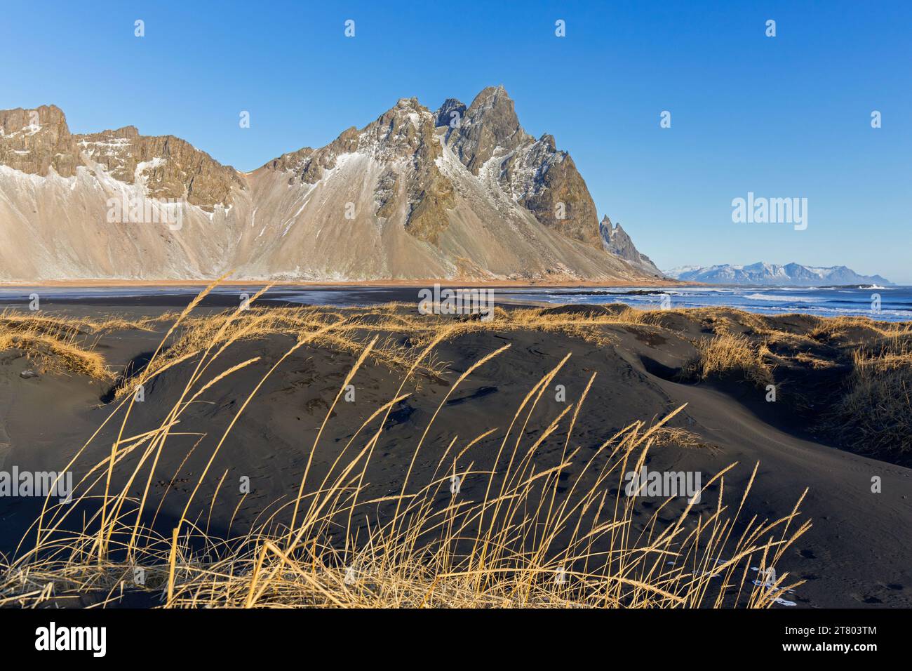Vestrahorn / Vesturhorn, scree mountain made of gabbro and granophyre rocks, part of the Klifatindur mountain range at Stokksnes in winter, Iceland Stock Photo