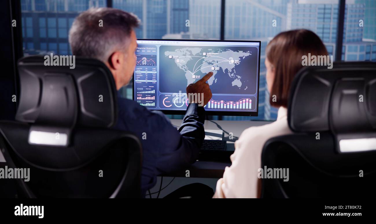 Financial Performance Analytics on Computer Dashboard with People Stock Photo