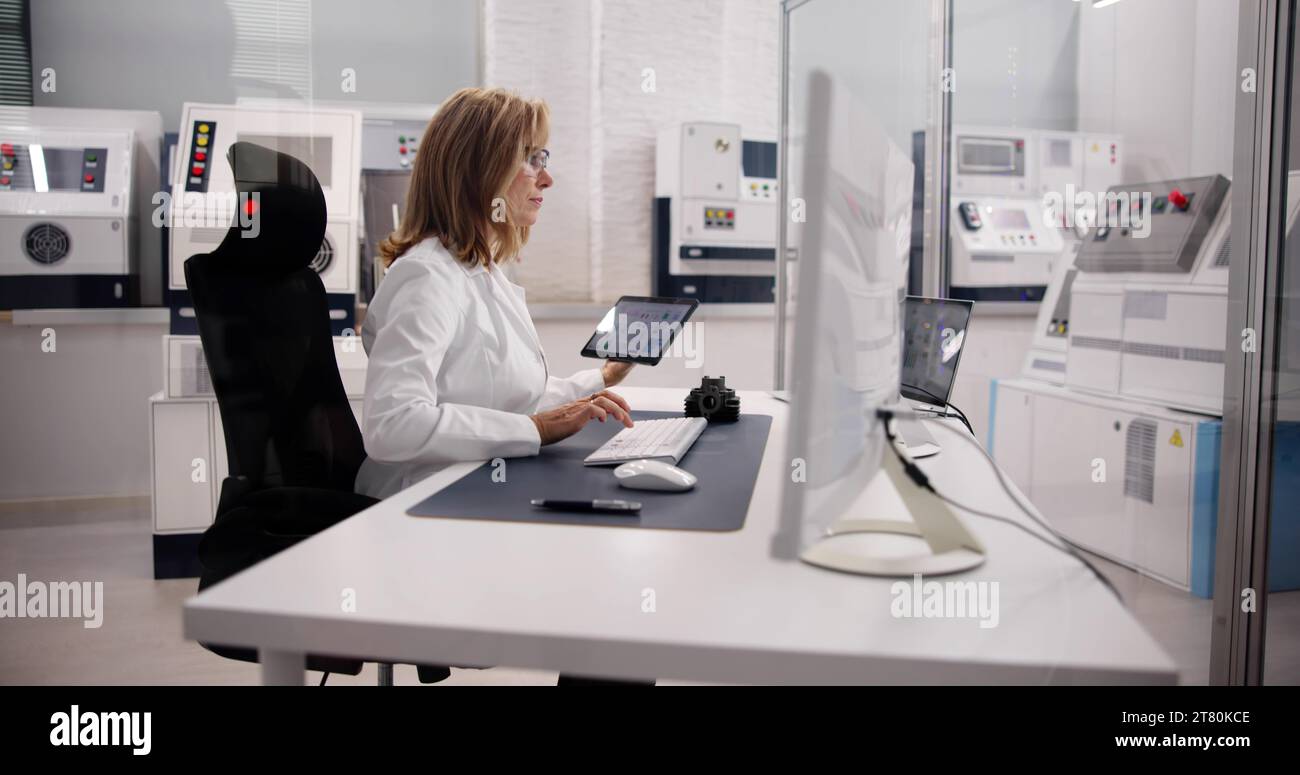 Medical Engineer Using Tablet in Manufacturing Industry Stock Photo