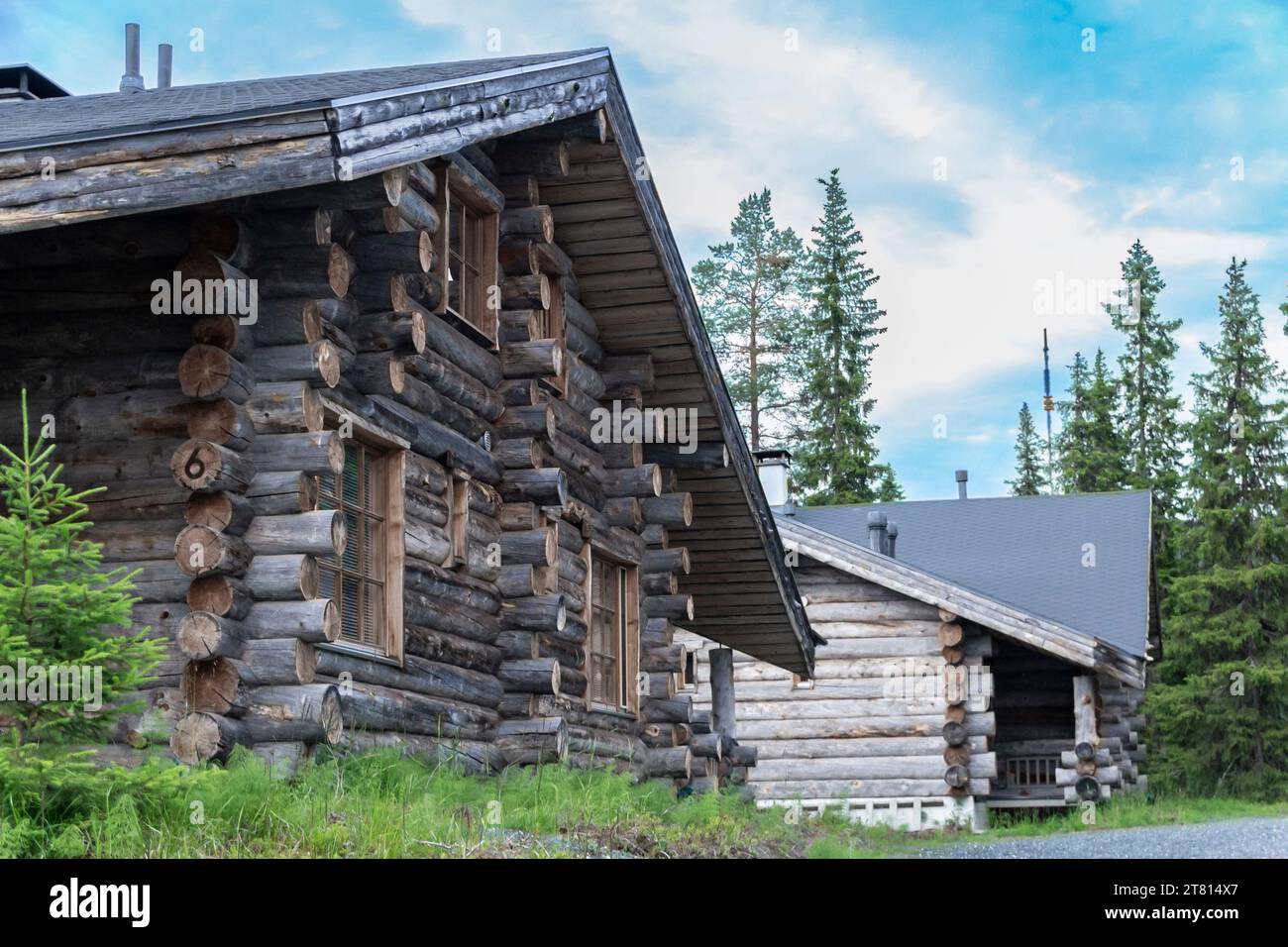 Two classic log cabins in the woodland in northern Finland Stock Photo