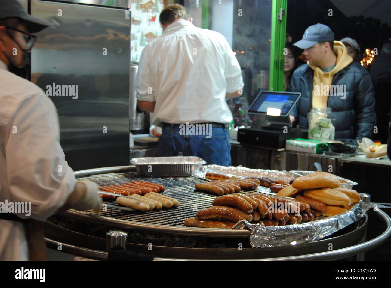 New York City, New York / USA - November 24 2022: German bratwurst at the Holiday Shops, Bank of America Winter Village at Bryant Park. Stock Photo