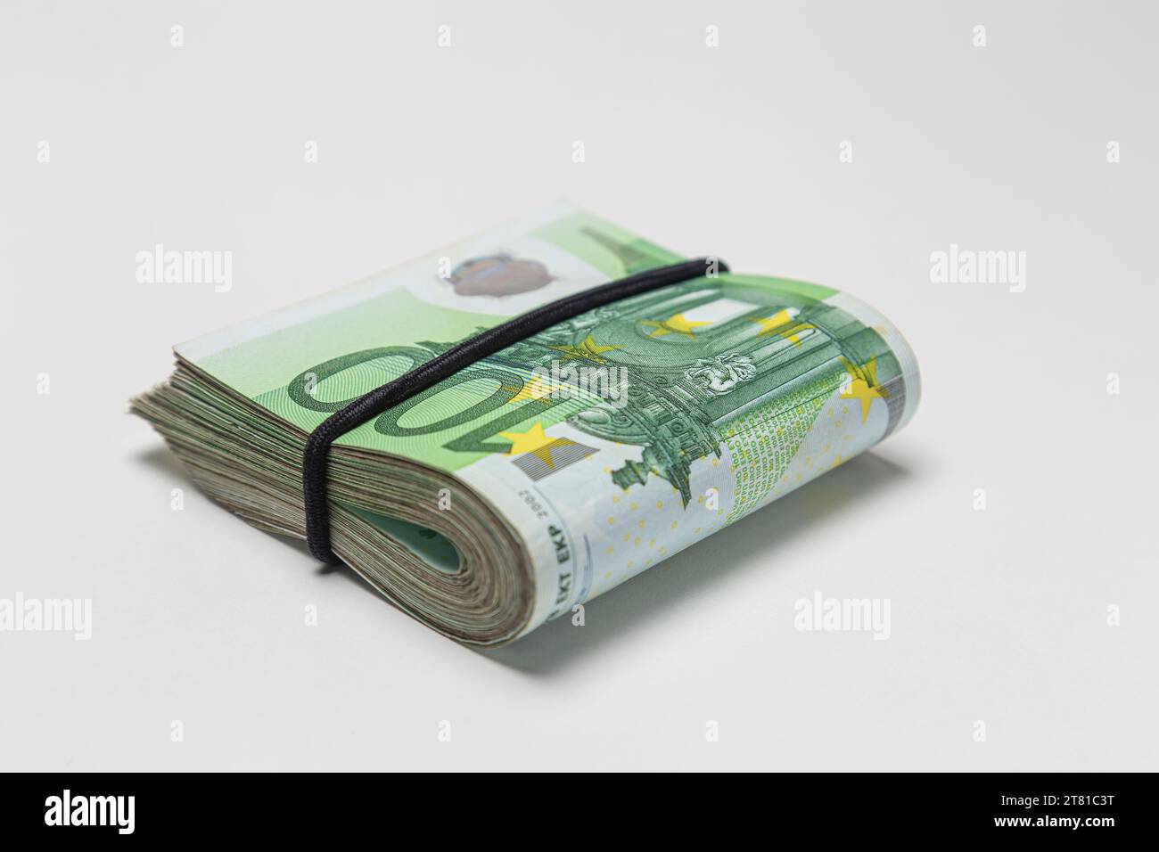 Bundle of 100 euro banknotes isolated on a white background. Stock Photo