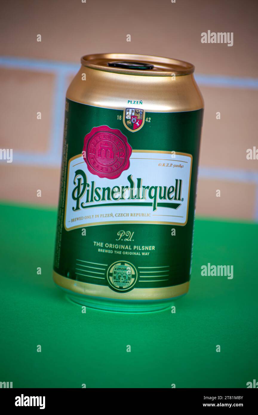 MALAGA, SPAIN - NOVEMBER 17, 2023: Bottle of Pilsner Urquell beer on brick wall background in Malaga, Spain on November 17, 2023 Stock Photo