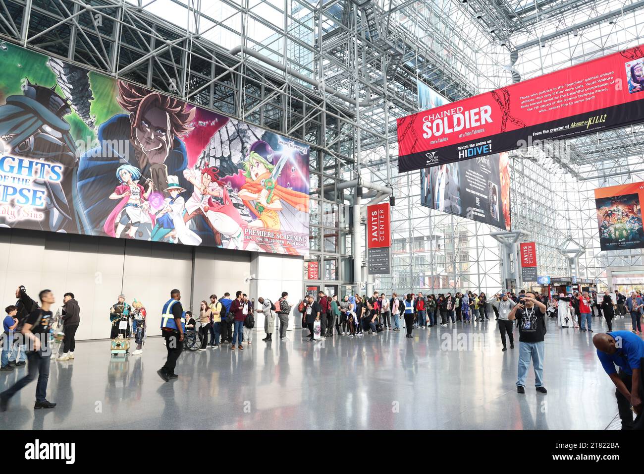 People wait for entry into the Anime NYC exhibition hall at the Jacob