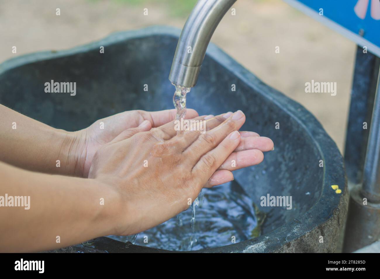 Washing hands with soap and water at the faucet, Hygiene concept Stock ...