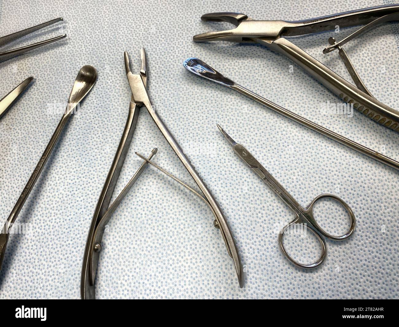 Surgical tools arranged on a surgical drape Stock Photo