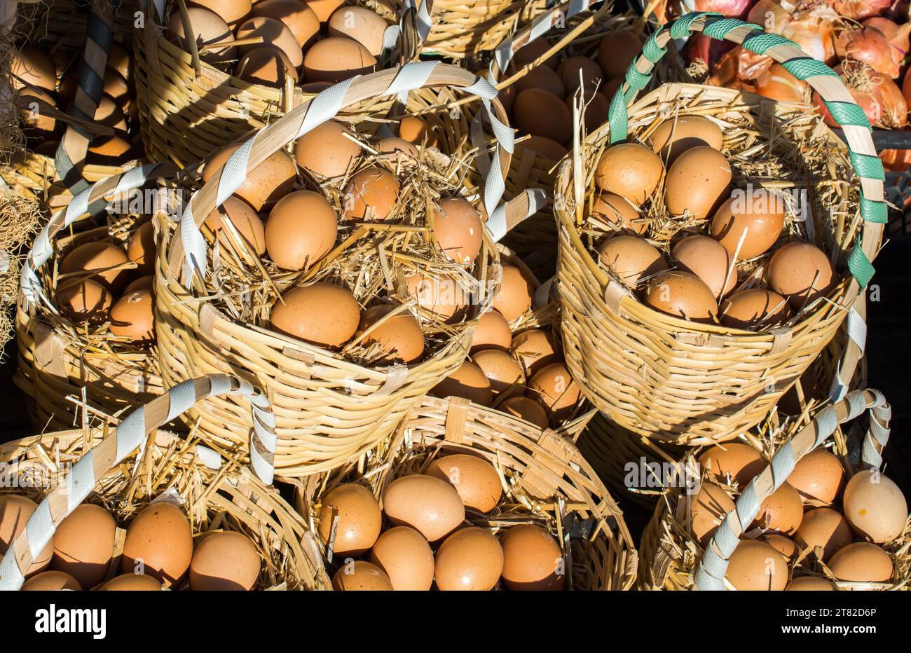 Organic fresh farm eggs in the straw basket Stock Photo - Alamy