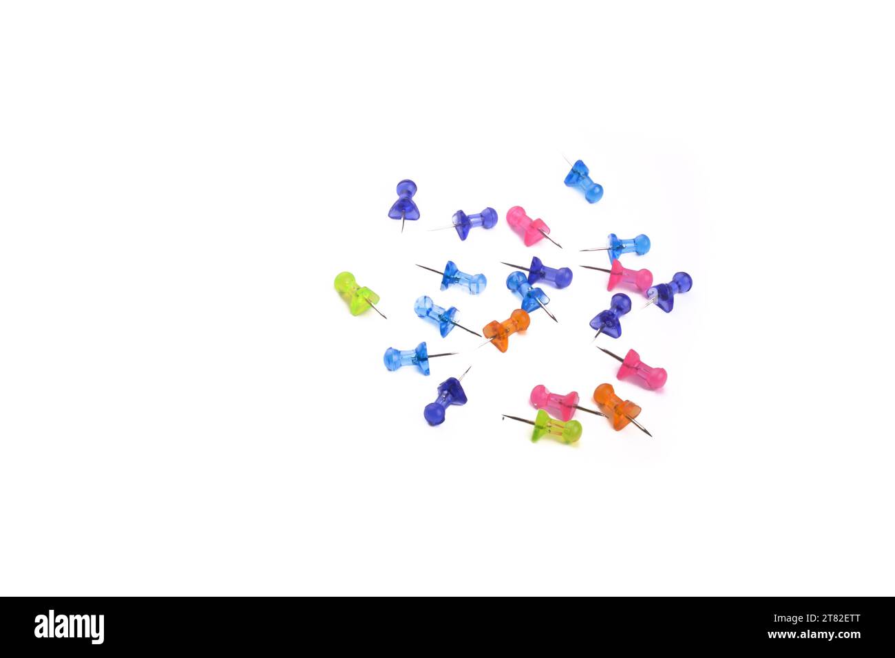 Colorful drawing-pins scattered on a white background Stock Photo