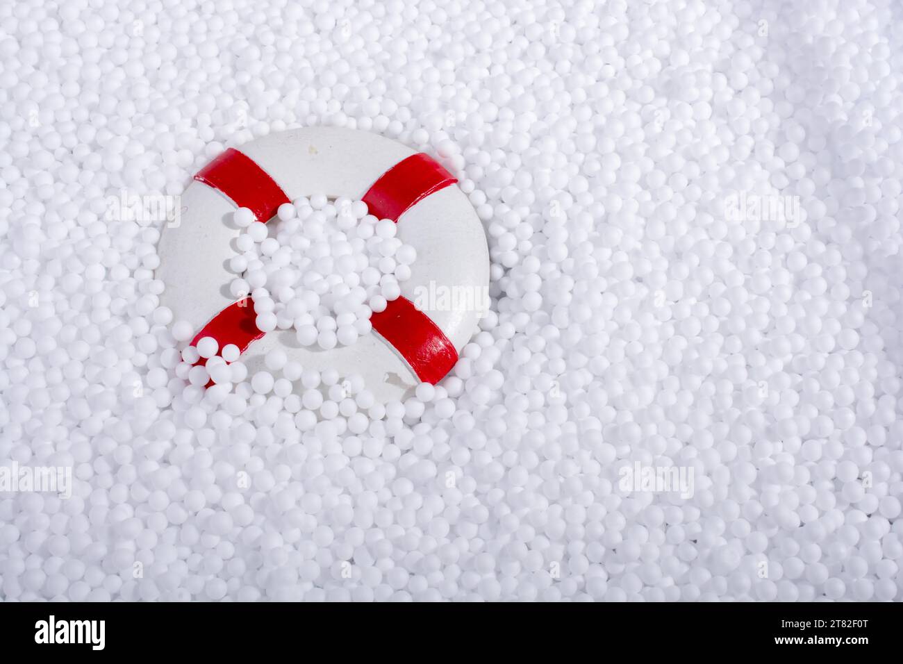 Lifesaver on little white polystyrene foam balls Stock Photo - Alamy
