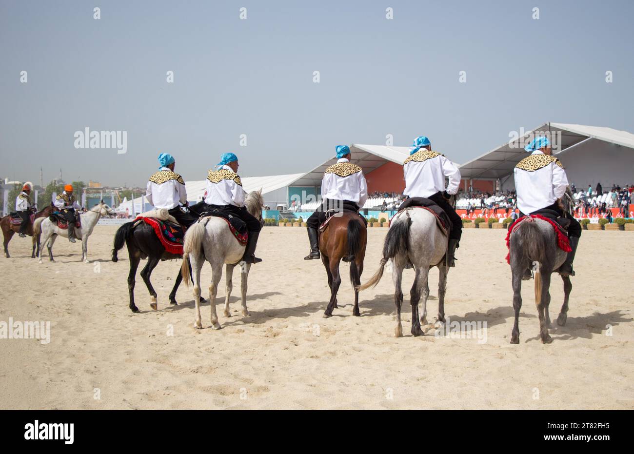 Horseman riding in their ethnic clothes on horseback Stock Photo Alamy
