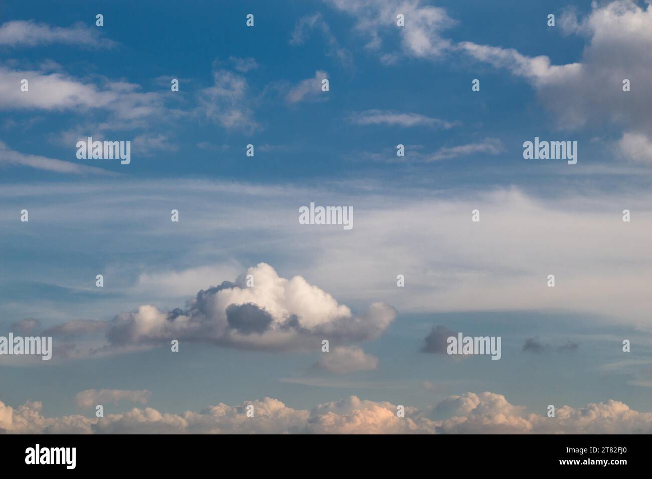 Blue Sky filled with white clouds Stock Photo