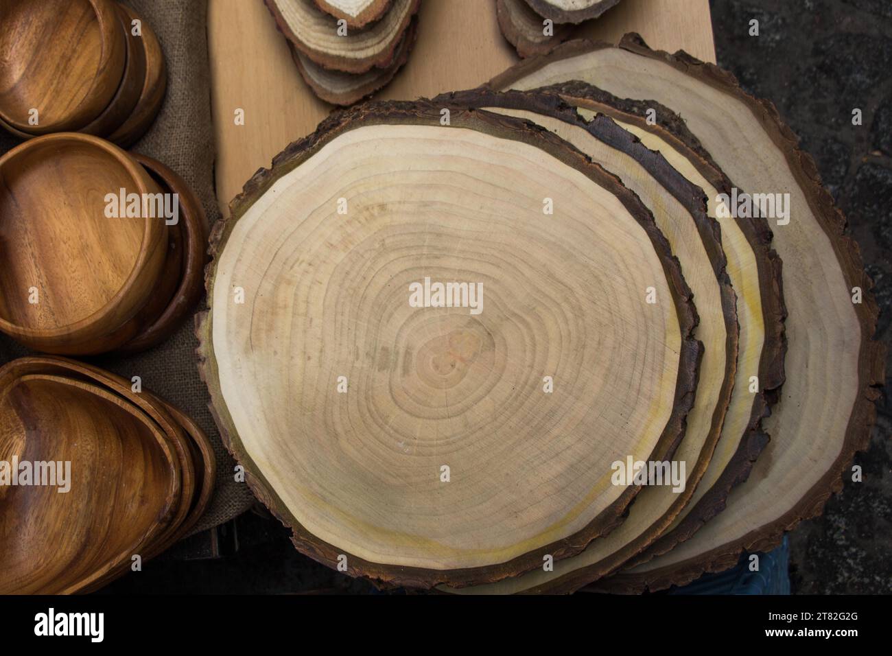 Wood Logs cut in round thin pieces on a white background Stock Photo