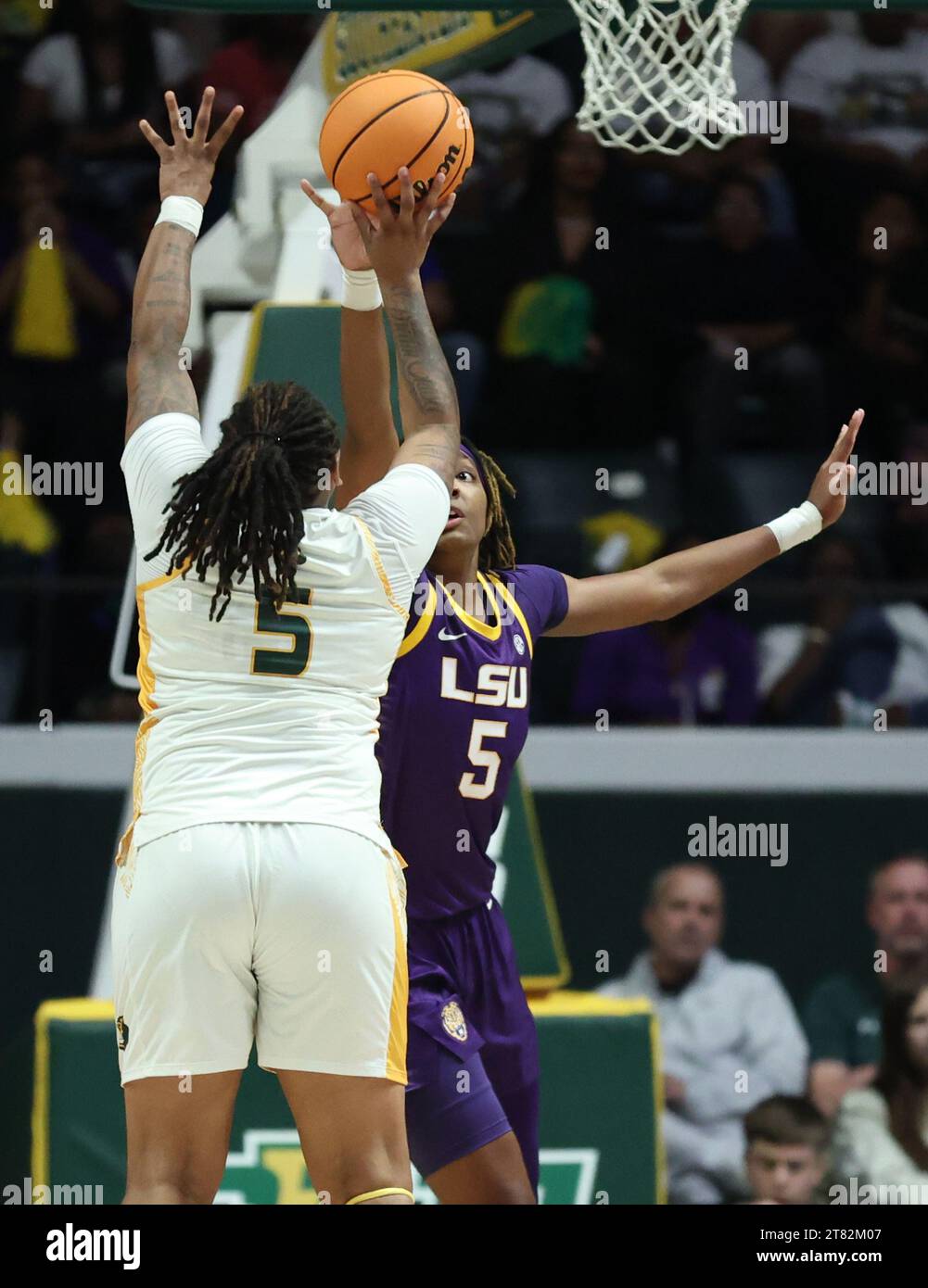 Hammond, USA. 17th Nov, 2023. SE Louisiana Lady Lions guard Taylor Bell (5) shoots a jumper against LSU Lady Tigers forward Sa'Myah Smith (5) during a women's college basketball game at the University Center in Hammond, Louisiana on Friday, November 17, 2023. (Photo by Peter G. Forest/Sipa USA) Credit: Sipa USA/Alamy Live News Stock Photo