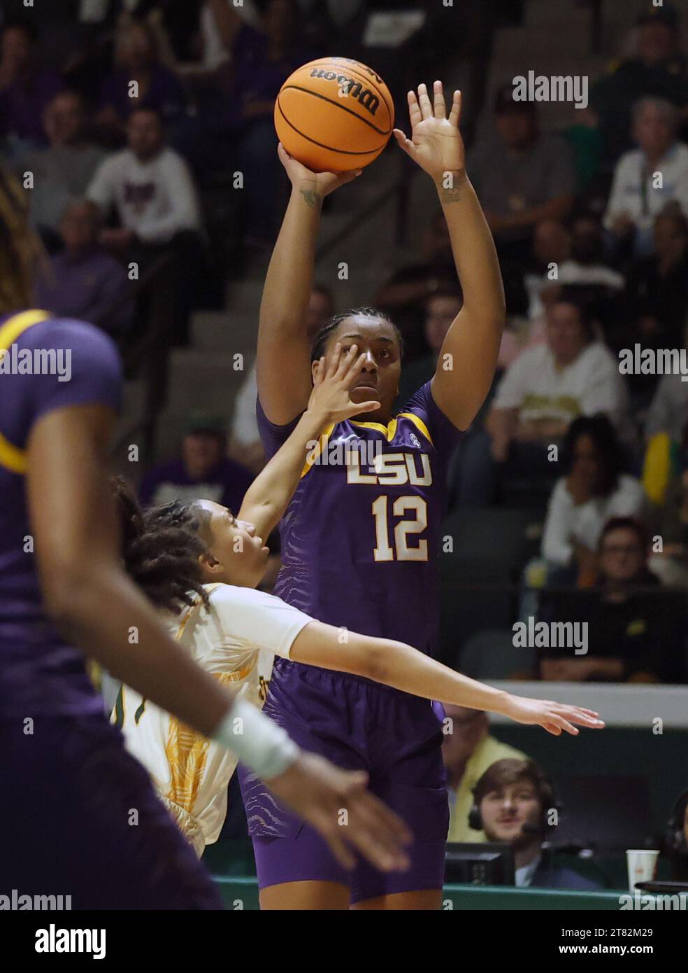 Hammond, USA. 17th Nov, 2023. LSU Lady Tigers guard Mikaylah Williams (12) shoots a three-pointer over SE Louisiana Lady Lions guard Avari Berry (11) during a women's college basketball game at the University Center in Hammond, Louisiana on Friday, November 17, 2023. (Photo by Peter G. Forest/Sipa USA) Credit: Sipa USA/Alamy Live News Stock Photo