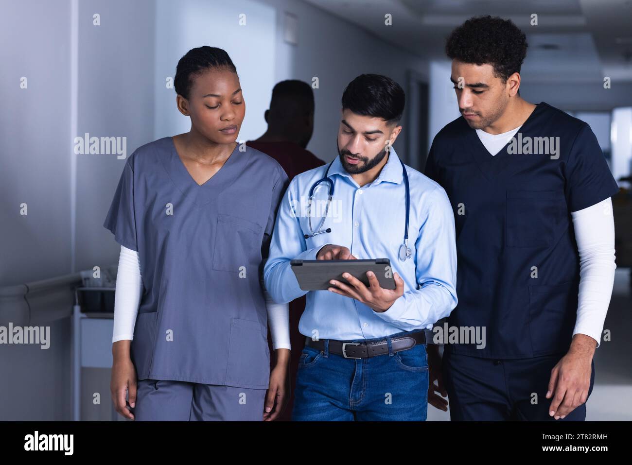 Diverse female doctors using tablet hi-res stock photography and images ...