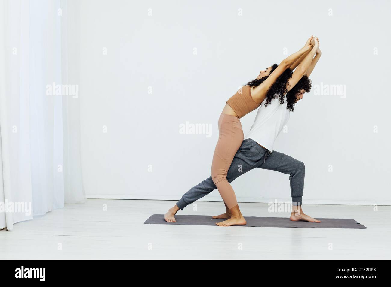 woman and man practice yoga lotus pose stretching healthy back asana ...
