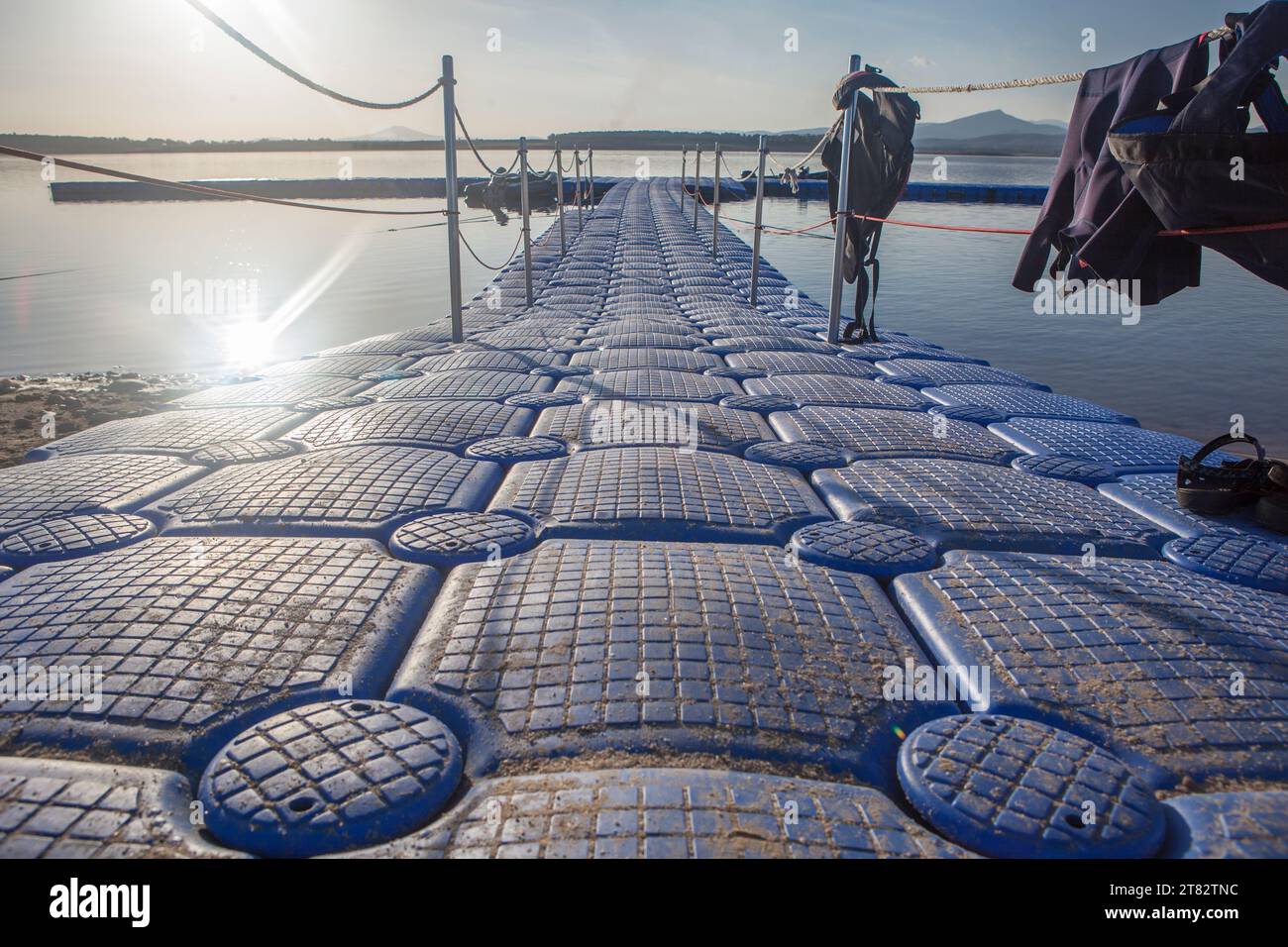 Modular pontoon with nautical clothing hanging from handrails. Gabriel y Galan reservoir, Caceres, Spain Stock Photo