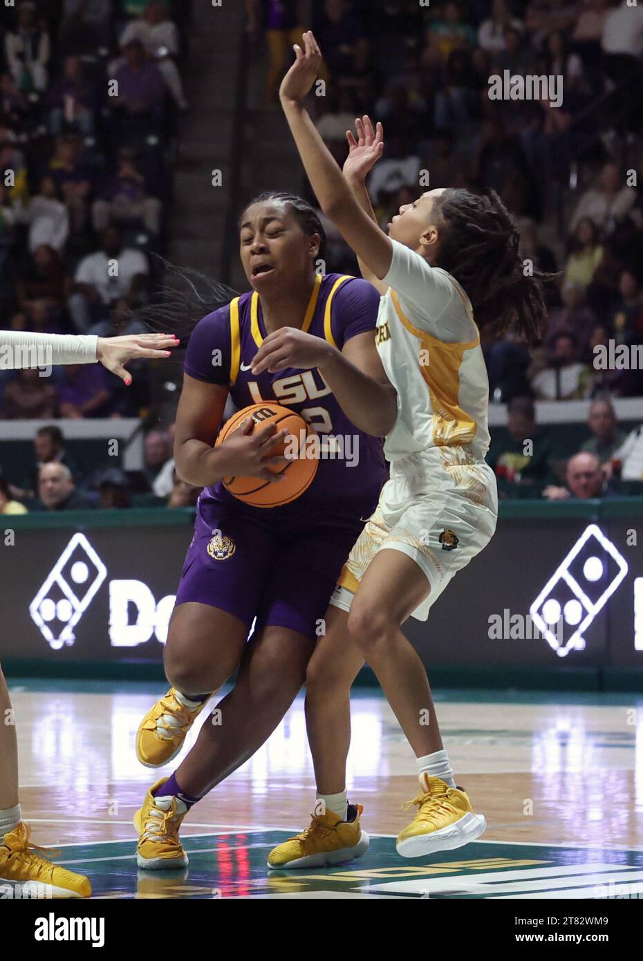 Hammond, USA. 17th Nov, 2023. LSU Lady Tigers guard Mikaylah Williams (12) makes a hard move against SE Louisiana Lady Lions guard Avari Berry (11) during a women's college basketball game at the University Center in Hammond, Louisiana on Friday, November 17, 2023. (Photo by Peter G. Forest/Sipa USA) Credit: Sipa USA/Alamy Live News Stock Photo