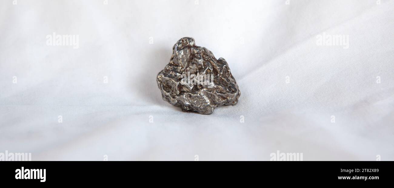 Nickeliron type meteorite fragment. Isolated over white background