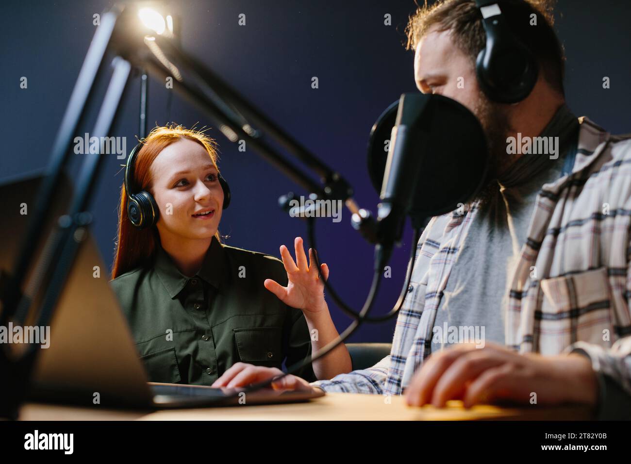 Man having conversation with woman in broadcast using