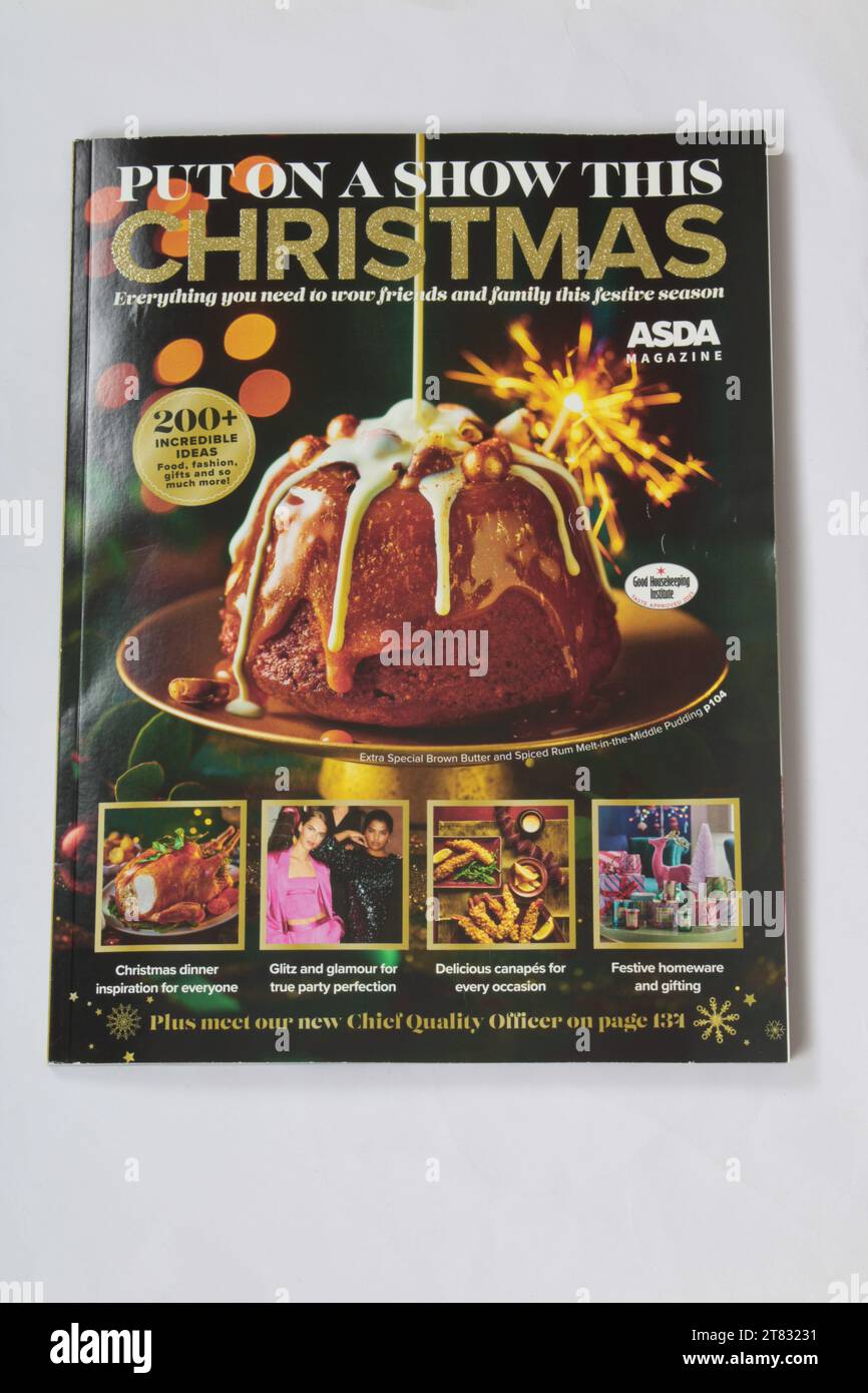 Asda Christmas food magazine 2023 on a plain background. Asda instore Christmas food guide magazine: Wigan, Manchester, UK, November 2023 Stock Photo