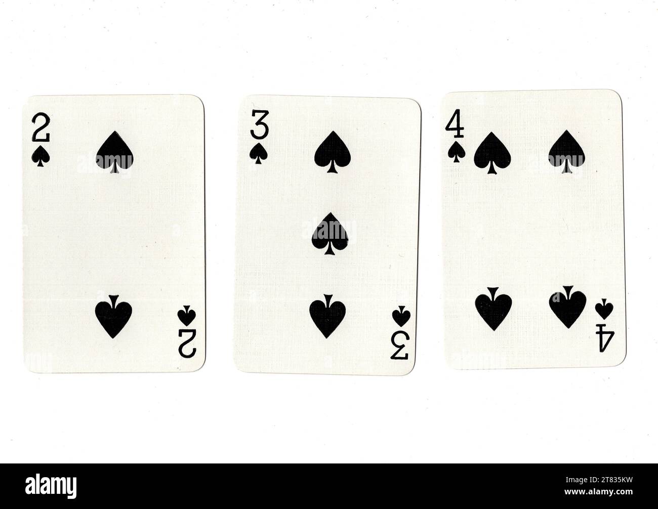Spades Rundown A run of three vintage playing cards showing a two, three and four of ...