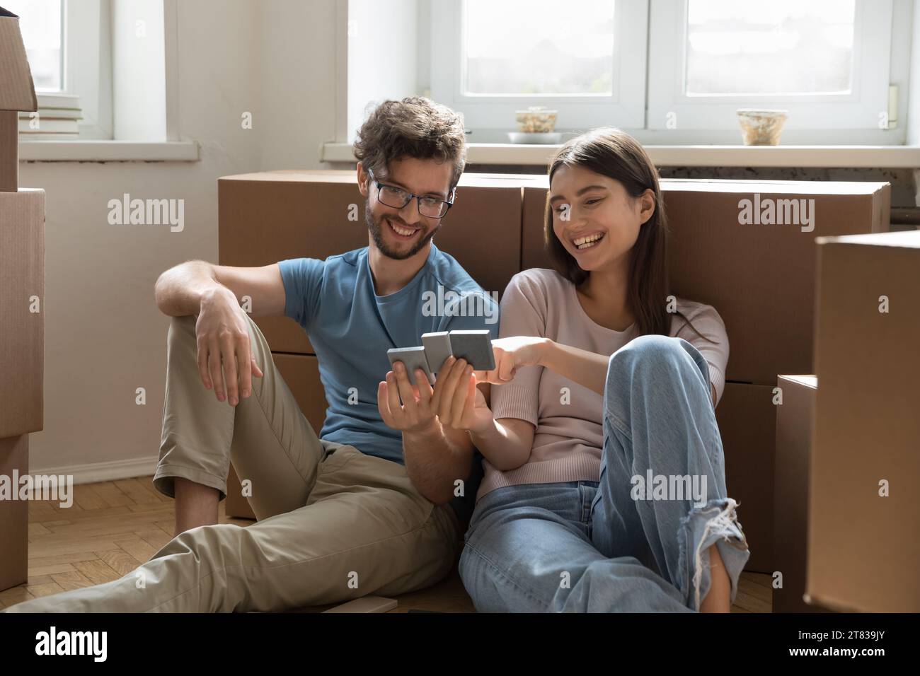 Photo inspiration: Picture Idea: Couple Planning Renovation Discussing Interior Design On Relocation Day Stock