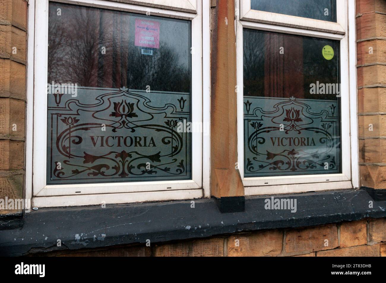 Leaded windows at the closed Victoria pub. Colne Road, Burnley. Stock Photo