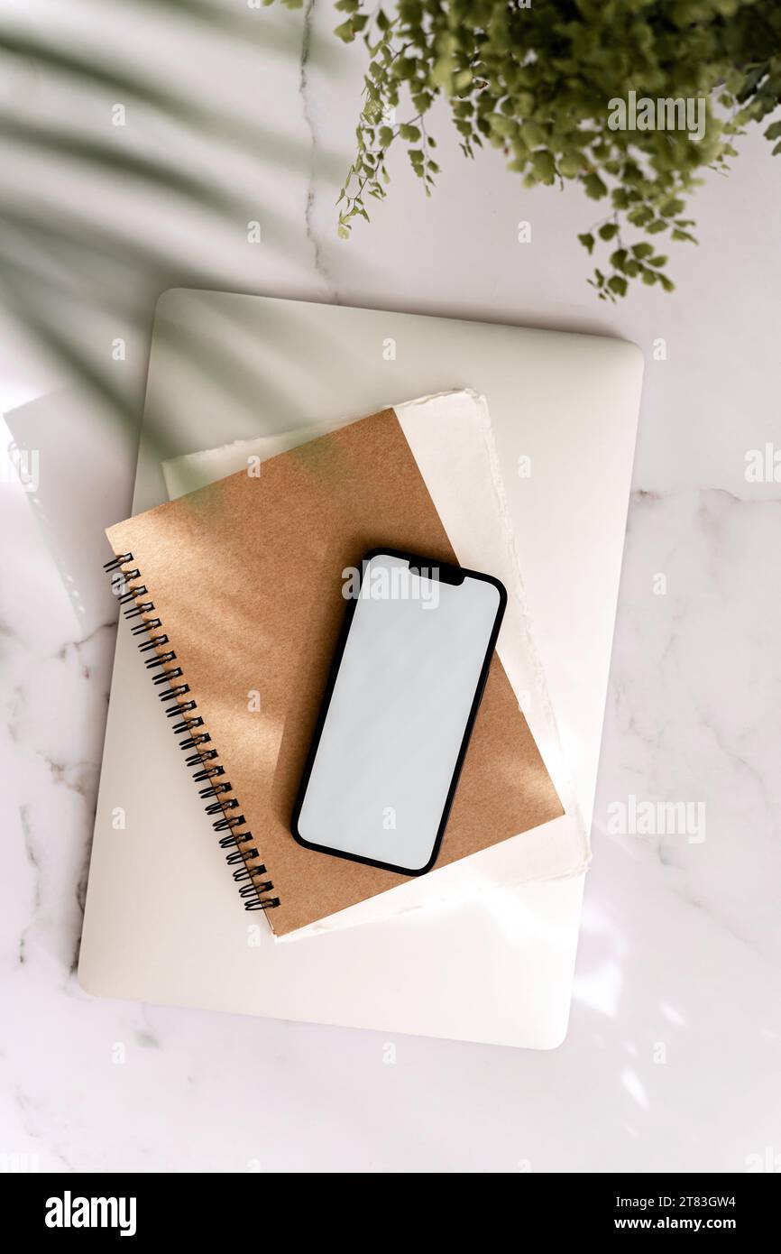Blank path screen mobile phone with mockup on various notepads and ...
