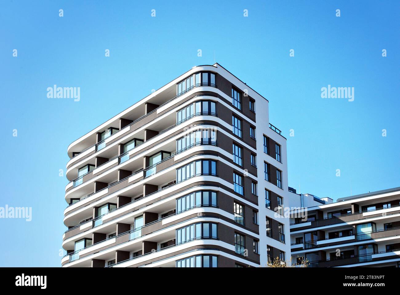 Modern apartment buildings on a sunny day with a blue sky. Facade of a ...