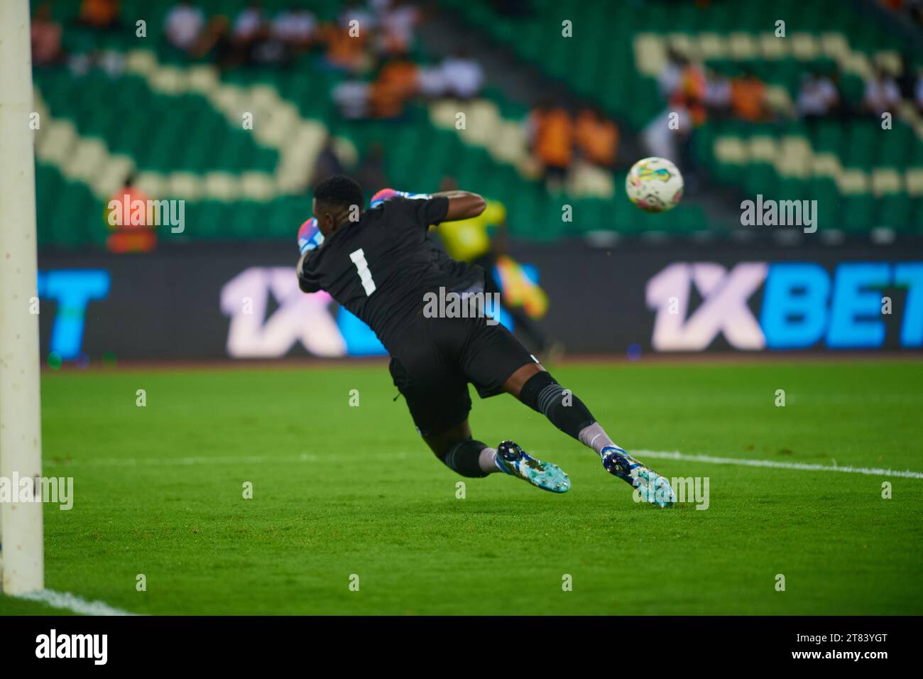 Ivorian goalkeeper Fofana Yahia trying to intercept a Seychellois shot Stock Photo