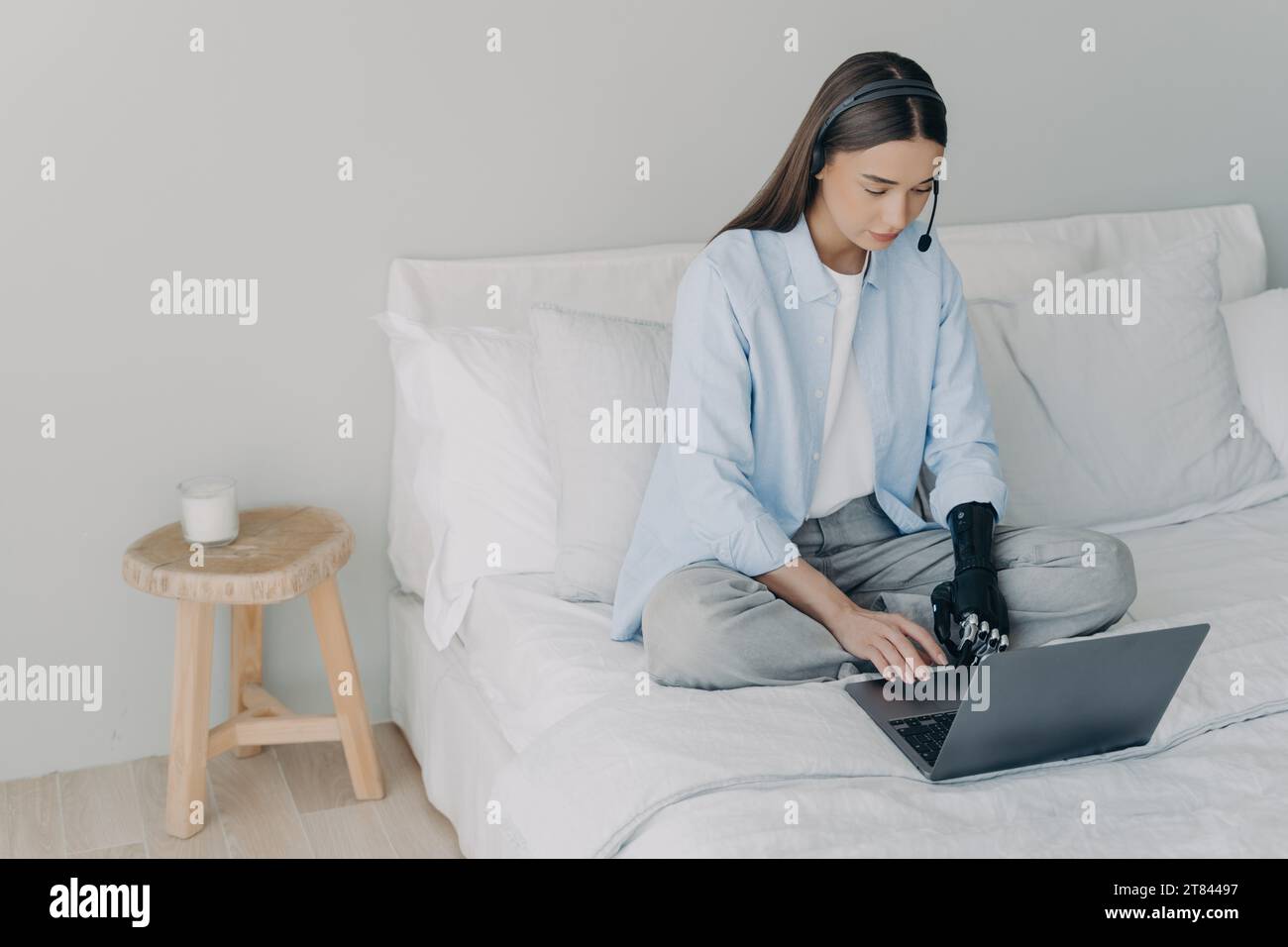 Professional multitasking at home with a bionic prosthetic arm Stock Photo